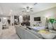 Open concept living room and kitchen with stainless steel appliances and tile floors at 6825 Citrus Creek Ln, Tampa, FL 33625