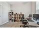 Well-equipped home office with shelving, workspace, and a comfortable chair at 6825 Citrus Creek Ln, Tampa, FL 33625