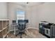 Functional office with a computer setup and a printer near the window at 6825 Citrus Creek Ln, Tampa, FL 33625
