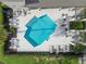 A clear, bright swimming pool surrounded by lounge chairs and lush landscaping providing a resort-style amenity for residents at 6825 Citrus Creek Ln, Tampa, FL 33625