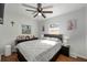 Cozy bedroom featuring a comfortable bed, ample natural light, and a ceiling fan for added comfort at 7003 Yule Ln, Tampa, FL 33637