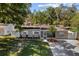 Charming single-story home featuring a well-maintained lawn and inviting front entrance at 7003 Yule Ln, Tampa, FL 33637