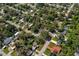 Aerial view of a quiet neighborhood with tree-lined streets and well-kept homes at 7003 Yule Ln, Tampa, FL 33637