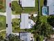 Aerial view of a single Gathering home showing the roof and surrounding neighborhood at 709 Pinewood Dr, Dunedin, FL 34698