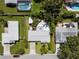 Aerial view of a single Gathering home showing the roof and surrounding neighborhood at 709 Pinewood Dr, Dunedin, FL 34698