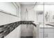 Stylish bathroom showcasing a glass shower with a tiled accent wall and modern fixtures at 709 Pinewood Dr, Dunedin, FL 34698