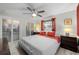 Inviting bedroom with modern lighting, sleek closet doors, and cozy ambiance perfect for relaxation at 709 Pinewood Dr, Dunedin, FL 34698