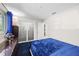 Comfortable bedroom with ample closet space and dark wood furnishings at 709 Pinewood Dr, Dunedin, FL 34698