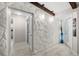 Entry hallway with stone wall and tile floors at 709 Pinewood Dr, Dunedin, FL 34698
