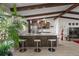 Modern kitchen with stainless steel appliances, granite countertops, and seating at the island at 709 Pinewood Dr, Dunedin, FL 34698