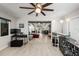 Open living space offering a bar area, view to living room with beam ceilings, and plenty of natural light at 709 Pinewood Dr, Dunedin, FL 34698