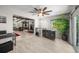 Bright and open living space with bar area, stylish decor, and seamless transition to the outdoor area at 709 Pinewood Dr, Dunedin, FL 34698