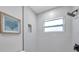 Detail of modern bathroom with sleek fixtures, white tiling, and a shower at 8045 Colton Dr, Port Richey, FL 34668