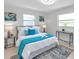 Bright bedroom with neutral decor, modern accents and plenty of natural light at 8045 Colton Dr, Port Richey, FL 34668