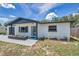 This cozy home boasts a stylish entryway with modern touches, adding to its curb appeal at 8045 Colton Dr, Port Richey, FL 34668