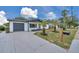 A lovely home with a welcoming entrance, featuring fresh paint and well-maintained landscaping at 8045 Colton Dr, Port Richey, FL 34668