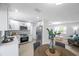 Bright, open kitchen with stainless steel appliances and modern finishes, flowing into living space at 8045 Colton Dr, Port Richey, FL 34668