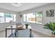 Bright office space with natural light, wood desk, and a view of the backyard at 8045 Colton Dr, Port Richey, FL 34668