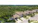 Aerial view of homes in a suburban neighborhood, showcasing the tree coverage and green spaces at 8050 Praise Dr, Tampa, FL 33625