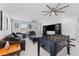 Bonus room with foosball table, comfortable seating and large entertainment center at 8050 Praise Dr, Tampa, FL 33625