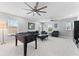 Spacious bonus room featuring multiple ceiling fans and a foosball table at 8050 Praise Dr, Tampa, FL 33625