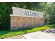 Attractive stone entrance sign that reads Allora, framed by lush greenery, welcoming residents and visitors at 8050 Praise Dr, Tampa, FL 33625