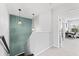 Upstairs landing featuring a decorative wall and a doorway to an office at 8050 Praise Dr, Tampa, FL 33625