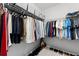 This large walk-in closet provides a lot of hanging and shelving options for clothing and shoes at 8050 Praise Dr, Tampa, FL 33625