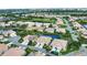 An aerial view of the homes in the community, with mature trees and landscaping and ponds at 8354 Palmetto Ct, Englewood, FL 34224