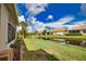 Enjoy water views from the backyard, with mature landscaping and beautiful views at 8354 Palmetto Ct, Englewood, FL 34224