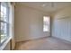 Bright bedroom featuring windows allowing ample natural light and a closet for ample storage at 8354 Palmetto Ct, Englewood, FL 34224