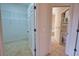 Walk-in closet featuring wire shelving and easy access to adjacent bathroom at 8354 Palmetto Ct, Englewood, FL 34224