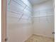 A walk-in closet provides ample storage with sturdy wire shelving throughout the space at 8354 Palmetto Ct, Englewood, FL 34224