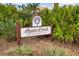 Oyster Creek Golf and Country Club sign surrounded by lush greenery at 8354 Palmetto Ct, Englewood, FL 34224