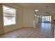 Bright, open dining room features large windows and tile flooring at 8354 Palmetto Ct, Englewood, FL 34224