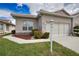 Attractive one-story home with a tiled roof, lamp post and manicured landscaping at 8354 Palmetto Ct, Englewood, FL 34224