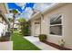Charming property featuring a well-maintained lawn, lush landscaping, and a welcoming entrance at 8354 Palmetto Ct, Englewood, FL 34224