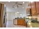 Open kitchen with stainless steel appliances and a breakfast bar overlooking the living area at 8354 Palmetto Ct, Englewood, FL 34224