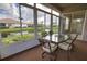 Enclosed patio with beautiful views of the pond and surrounding landscape at 8354 Palmetto Ct, Englewood, FL 34224