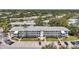 Aerial view of the apartment complex including parking, landscaping and green space at 8396 111Th St # 301, Seminole, FL 33772