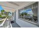 A balcony view of white condo building with view of trees at 8396 111Th St # 301, Seminole, FL 33772