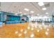 Large ballroom featuring a stage, ample lighting, and a spacious dance floor, perfect for community events at 8396 111Th St # 301, Seminole, FL 33772