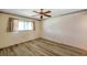 Relaxing bedroom with vinyl floors, window, and a ceiling fan at 8396 111Th St # 301, Seminole, FL 33772