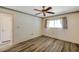 Comfortable bedroom with vinyl floors, window, and a ceiling fan at 8396 111Th St # 301, Seminole, FL 33772