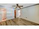 Spacious bedroom with vinyl floors and access to an ensuite bathroom and closet at 8396 111Th St # 301, Seminole, FL 33772