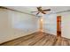 Cozy bedroom with vinyl floors, ceiling fan, and closet at 8396 111Th St # 301, Seminole, FL 33772