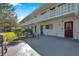 Exterior view of a community patio with seating and BBQ, ideal for outdoor entertaining and relaxing at 8396 111Th St # 301, Seminole, FL 33772