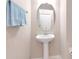 Bathroom with pedestal sink and modern fixtures at 9317 Stone River Pl, Riverview, FL 33578