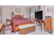 Bedroom with wood furniture and natural light at 9317 Stone River Pl, Riverview, FL 33578