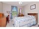 Comfortable bedroom with light blue accents, study desk, and natural light at 9317 Stone River Pl, Riverview, FL 33578